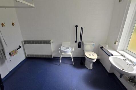 Spacious accessible bathroom with natural light...
