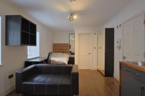 Studio with sofa and bed