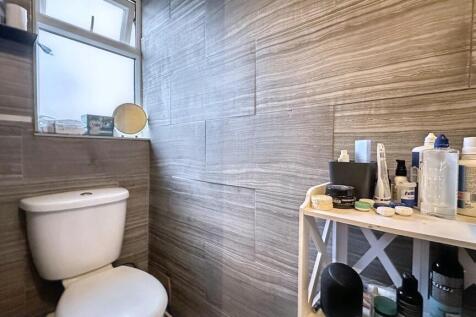 Modern bathroom with stylish textured tiles...