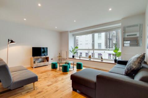 Bright lounge with floor-to-ceiling windows...