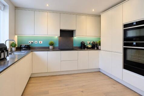 Kitchen with fitted appliances