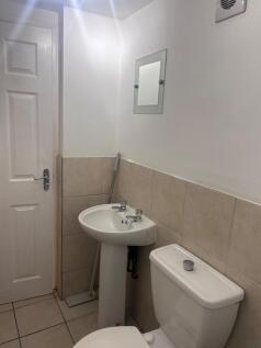 A clean and tidy bathroom featuring essential a...