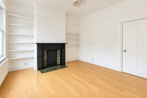 Bright Minimalist Room with Victorian Fireplace