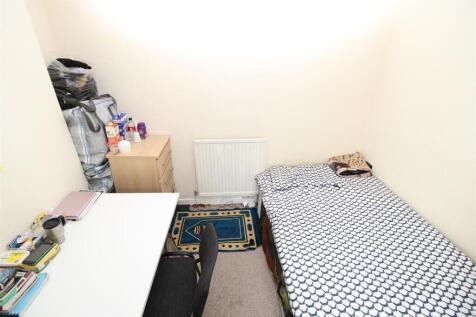 Bright study space with desk and storage....