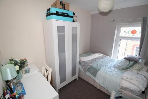 Bright bedroom with ample storage and desk area...