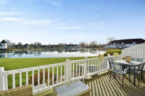 Decking, gardens and a lake view