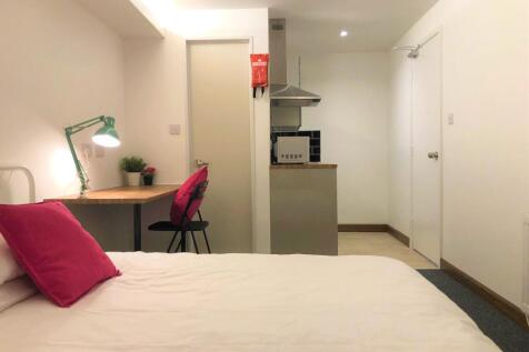 Bright and tidy double bedroom featuring a comf...