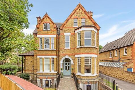 The ground floor of the property comprises lounge with feature fireplace, modern fitted kitchen, and w/c. The lower ground floor offers a large primary bedroom with an ensuite shower room, a second do