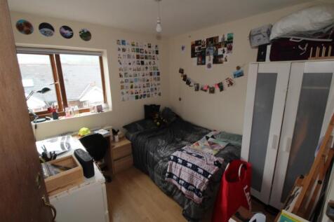 Bright bedroom with ample storage and desk spac...