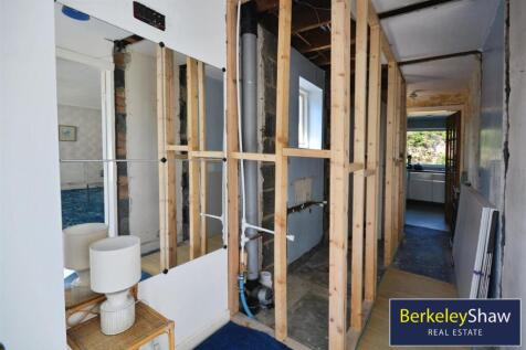 Hallway with plumbed shower room