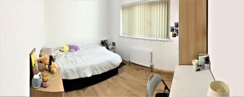 Spacious and bright double bedroom featuring a ...