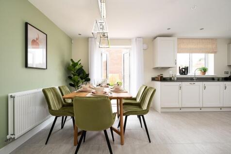 Beautiful dining room with double door opening to the garden