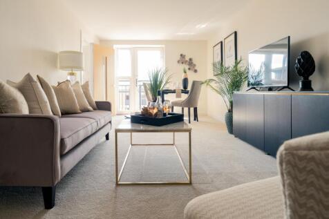 a living room with a table and couches