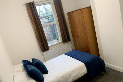 Bright and tidy bedroom with ample storage...