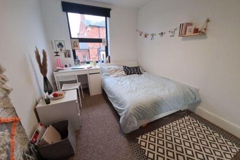 Bright and cozy single bedroom featuring a comf...