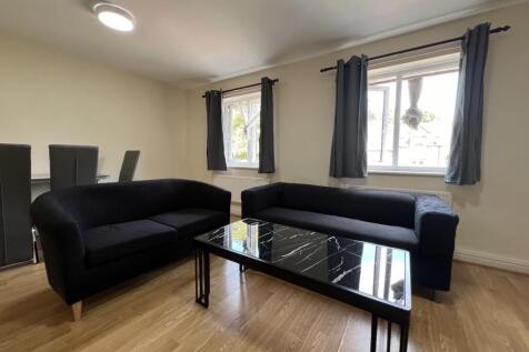 Bright, modern living room with two comfortable...