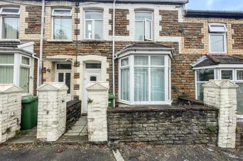 Charming stone terrace with bright bay window...