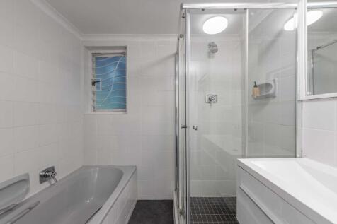 Full bathroom with bath, full shower &amp; vanity