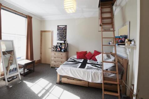 Spacious bright bedroom with unique loft access...