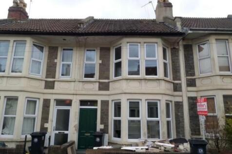 Traditional terraced house with bay windows and...
