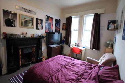 A cozy and inviting master bedroom featuring a ...