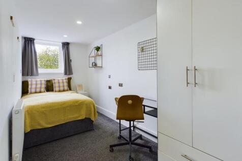 A bright and inviting double bedroom featuring ...