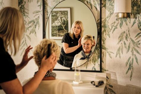 a person taking a selfie in a mirror