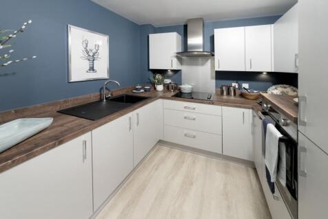 a kitchen with white cabinets