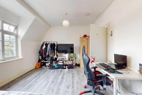 Bright and spacious bedroom with desk area...