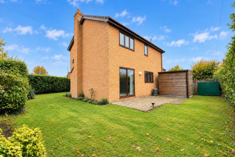 Sunny Suburban Garden and Brick House.png