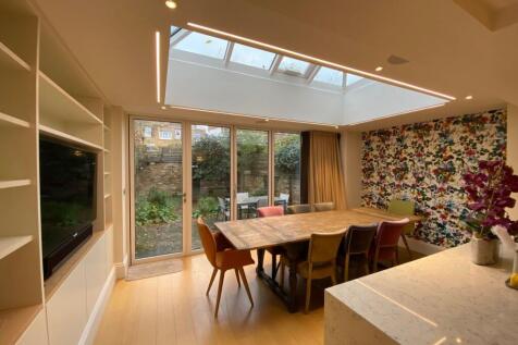 Bright, modern open-plan dining and living area...