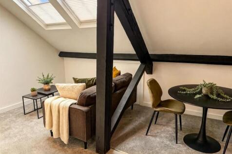 02_Flat52_Living_Room_Second_Angle_Cushions_Plants