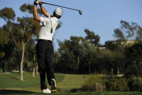 Man playing golf