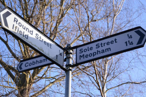 street sign round street