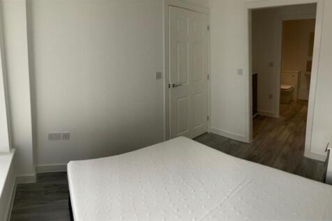 Bright, neutral double bedroom with modern floo...