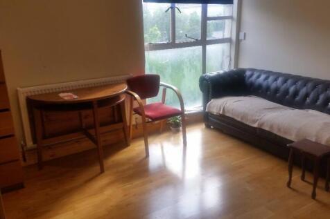 Bright living area with classic leather seating...