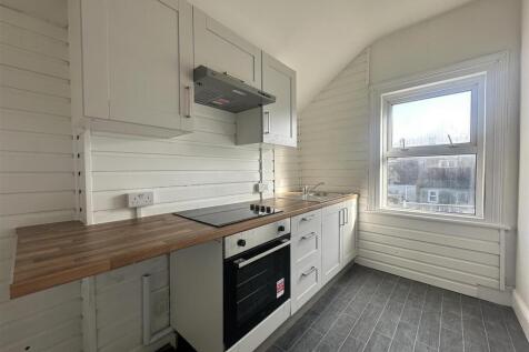 Bright fitted kitchen with wooden worktops...