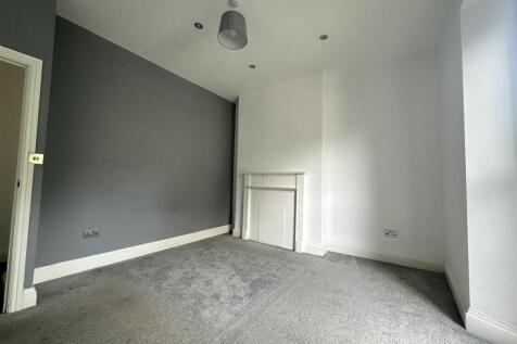 Modern double bedroom with stylish feature wall...