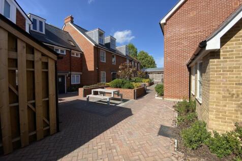 Bright modern courtyard with picnic seating...