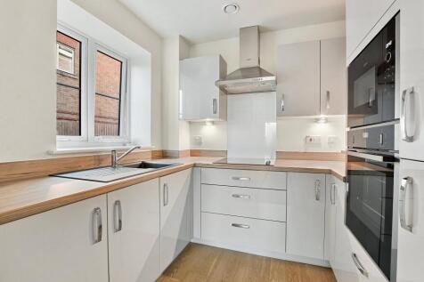 a kitchen with white cabinets