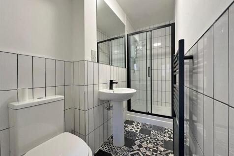 Modern bathroom with stylish tiled flooring...