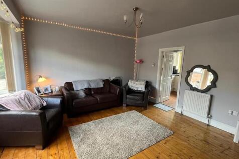 Bright, well-presented living room with wooden ...