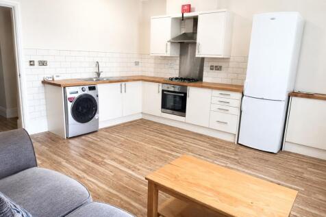 Modern open kitchen with stylish wood worktops...