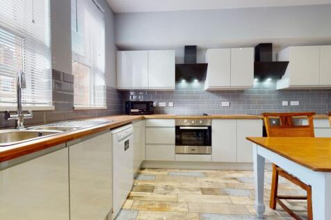 Modern kitchen with ample natural light from la...