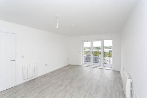 Bright, airy lounge with scenic balcony doors...