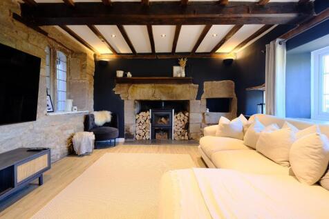 Sumptuous sitting room with log burner