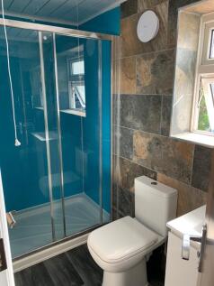 Bright and modern bathroom featuring a clean wh...