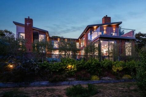 Striking rear elevation with glass-fronted balconi