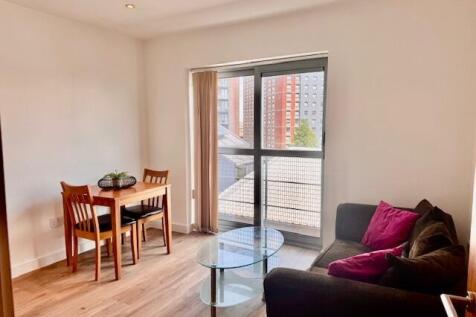 Bright living area with large floor-to-ceiling ...