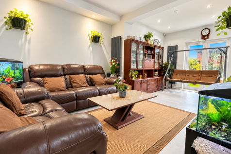 Plant-Filled Leather Sofa Living Room.png